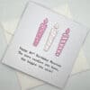 80th birthday card with candles in pink above scaled