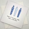 8th birthday card with candles in blue above scaled