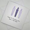 9th birthday card with candles in purple above